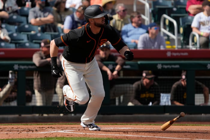 SF Giants right fielder Mitch Haniger (17) hits against the San Diego Padres in the first inning at Scottsdale Stadium. (2023)